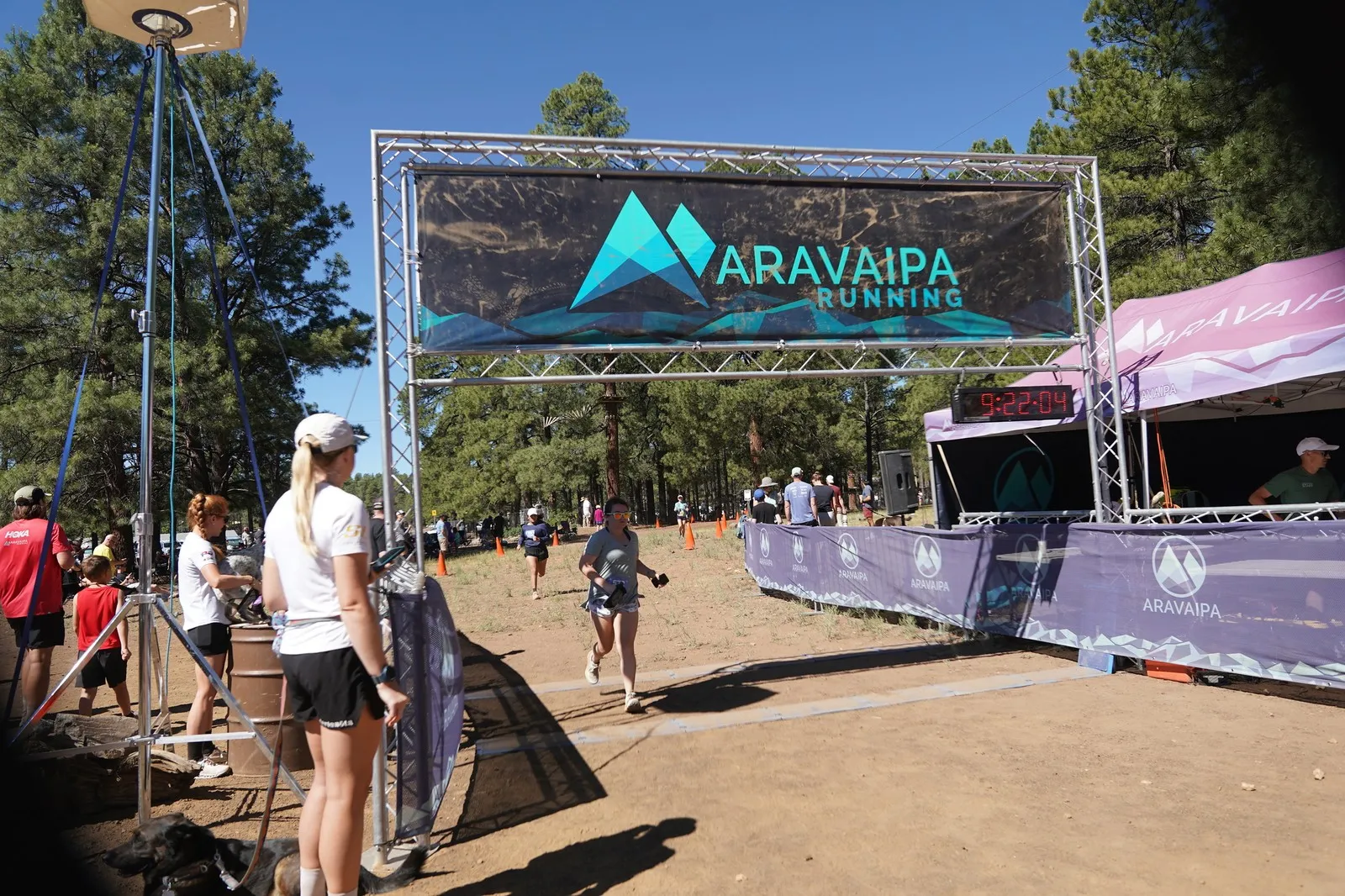 Runners on the run-in at the Big Pine Trail Runs finish line in the Flagstaff ponderosa pines