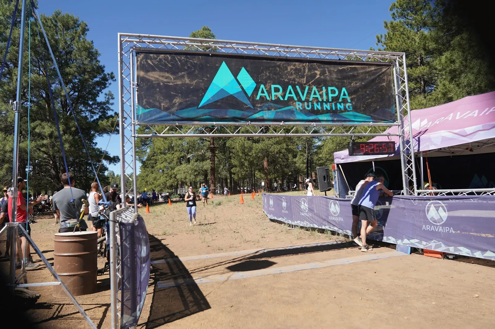 A runner far out on the run-in at the Big Pine Trail Runs finish line in the Flagstaff ponderosa pines