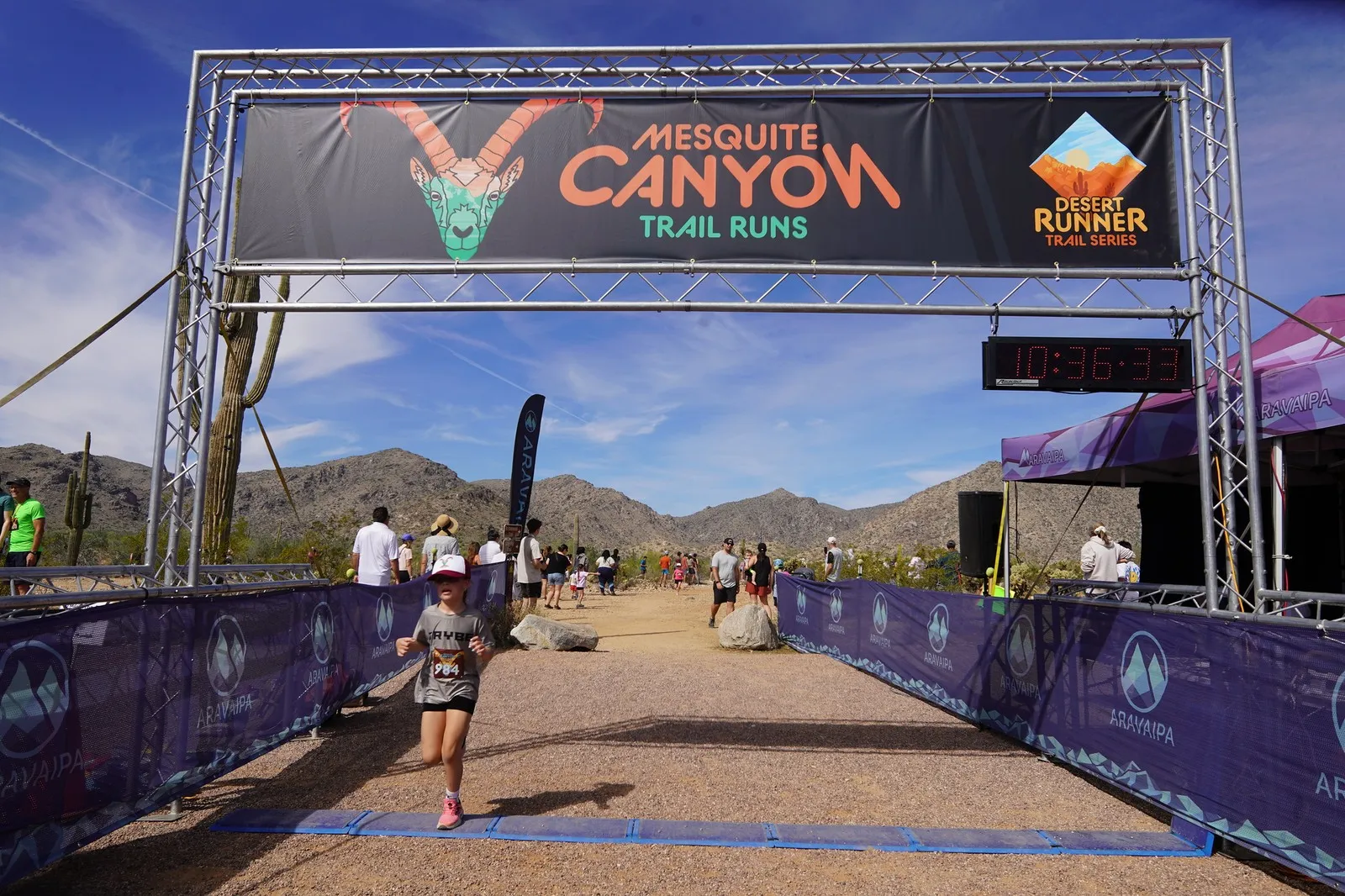 A runner coming in to the Mesquite Canyon Trail Runs finish line, a Sonoran Desert Cup race in White Tank Mountain Regional Park